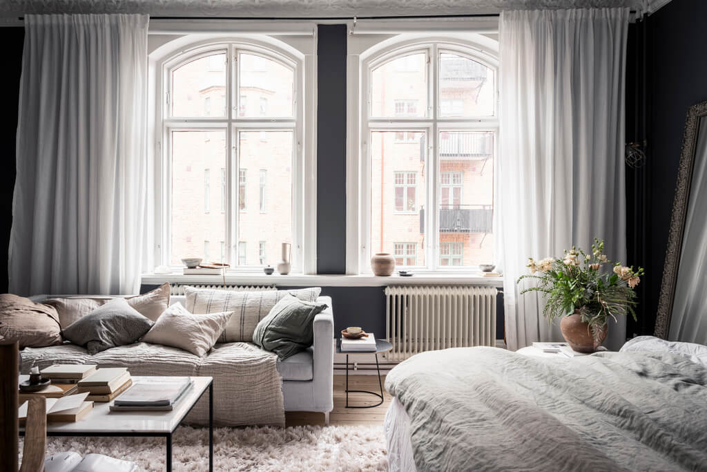 A Scandinavian Studio Apartment with Black Walls 10 large windows black studio apartment