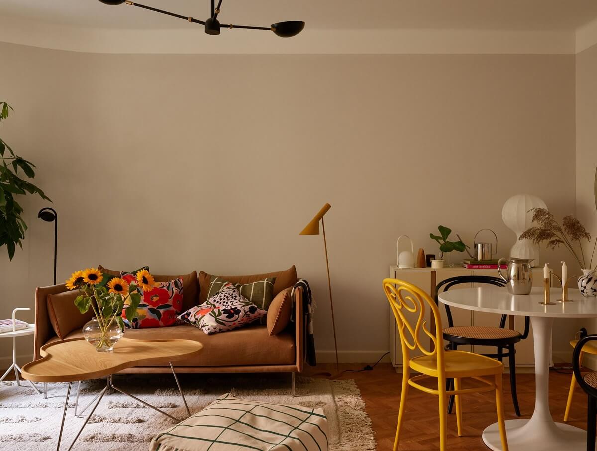 A Serene Light Colored Apartment with Bright Color Pops 7 living room beige walls yellow dining chair