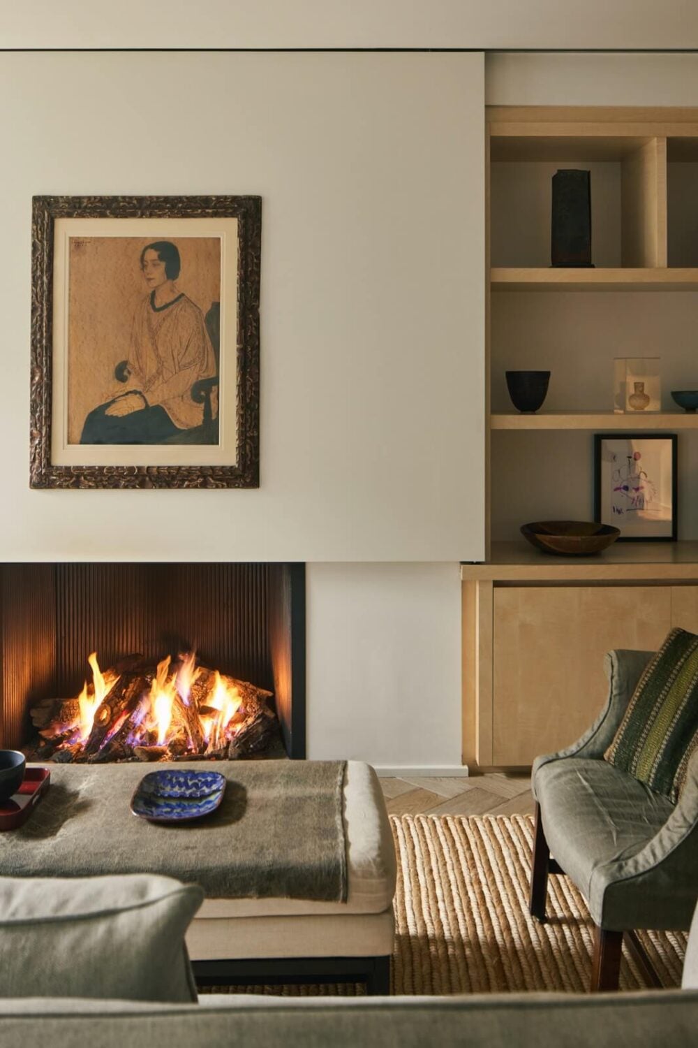 Stylish Monochrome Interiors in an Early 20th Century House 5 living-room-fireplace-wooden-bookshelves-nordroom