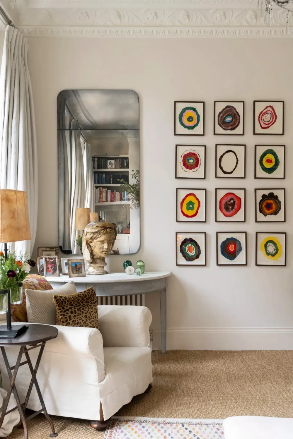 A Light Apartment with Arched Windows and a Garden in Maida Vale 3 living room gallery wall mirror