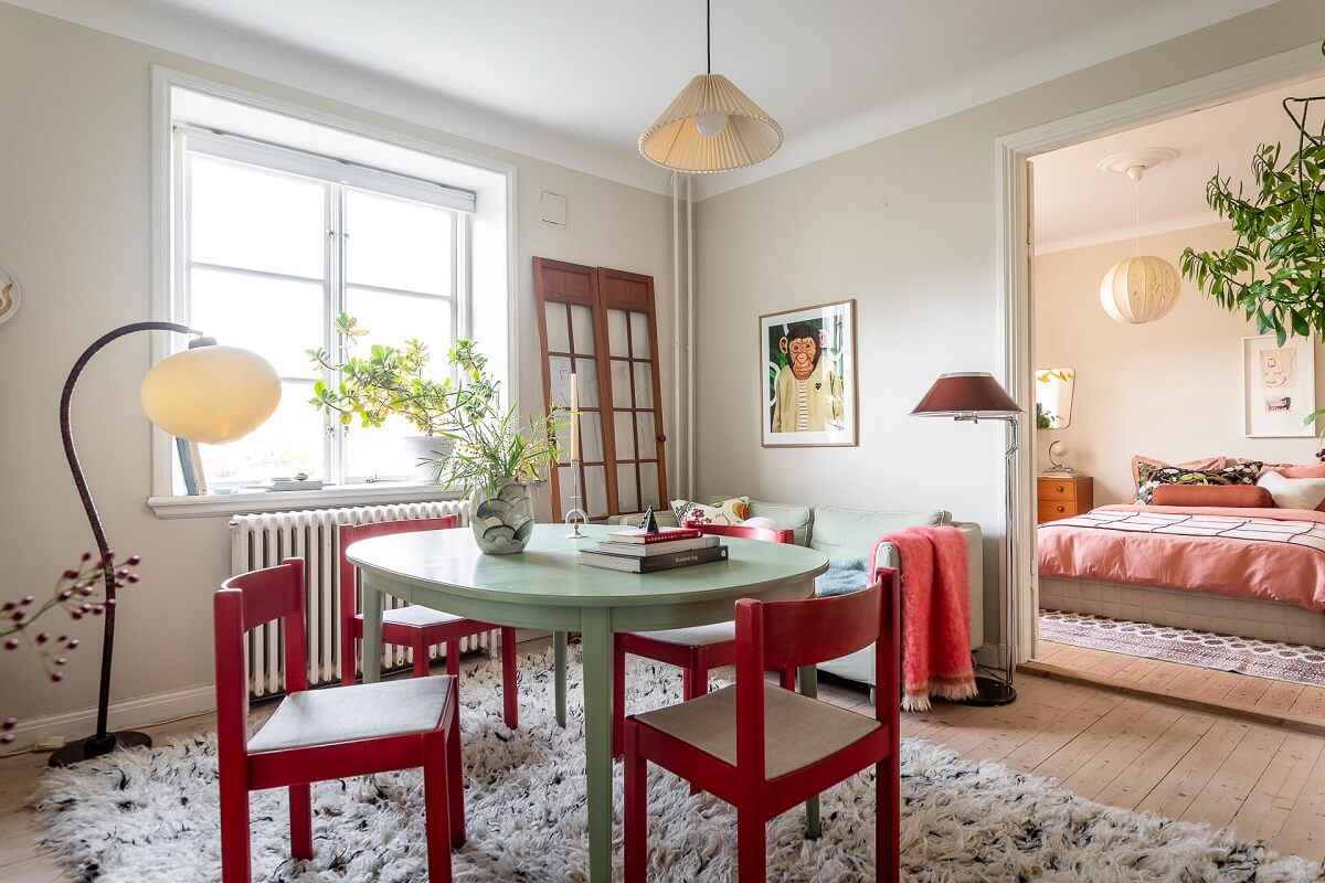 Colorful Decor in a Scandinavian Apartment 5 living-room-mint-green-dining-table-red-chairs-nordroom
