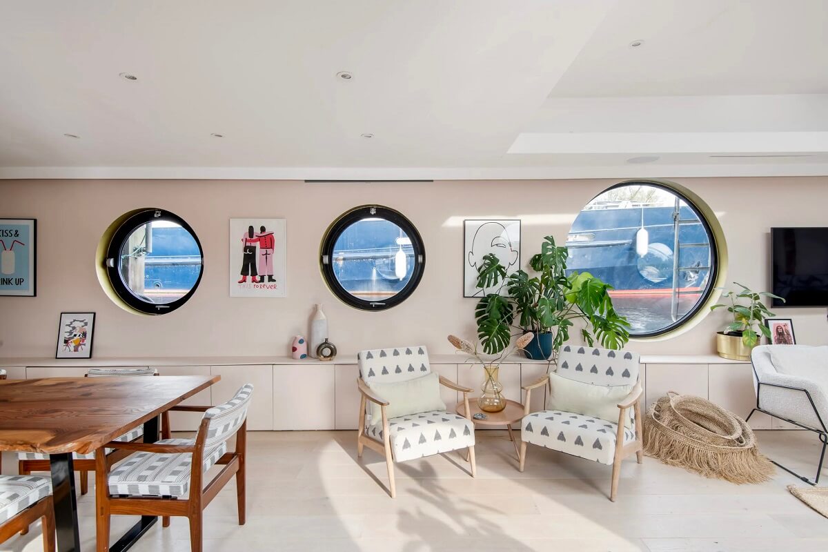 A Spacious and Stylish Houseboat in London 3 living room round windows houseboat london nordroom