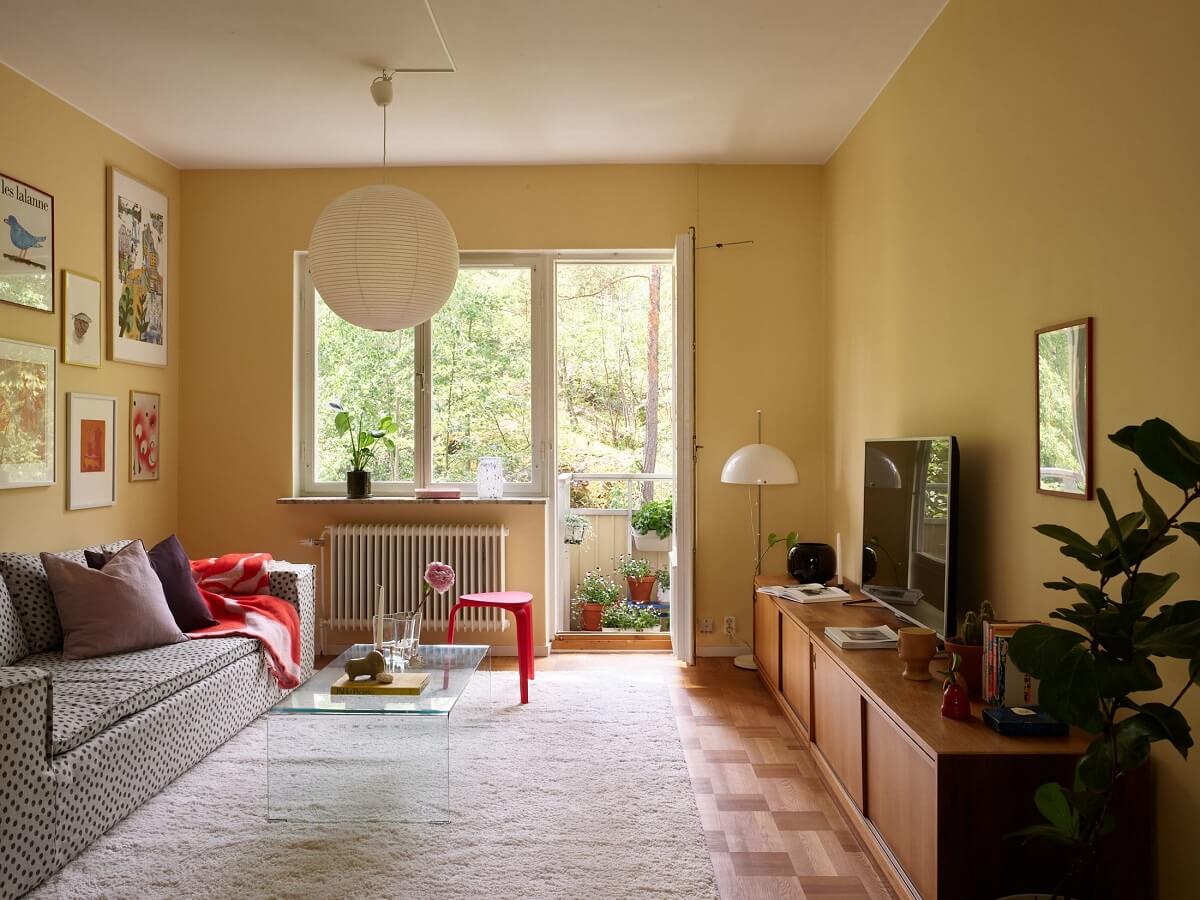Soft Yellow Walls in a Swedish Apartment 5 living-room-yellow-walls-gallery-wall