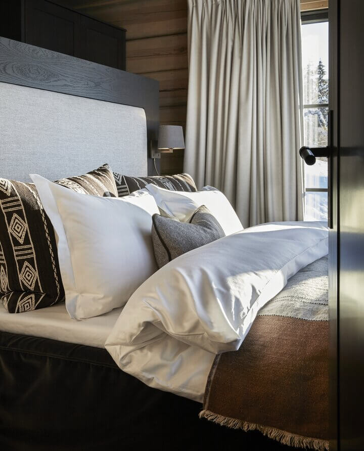 A Modern Norwegian Log House Decorated for Christmas 9 log cabin bedroom hotel style nordroom