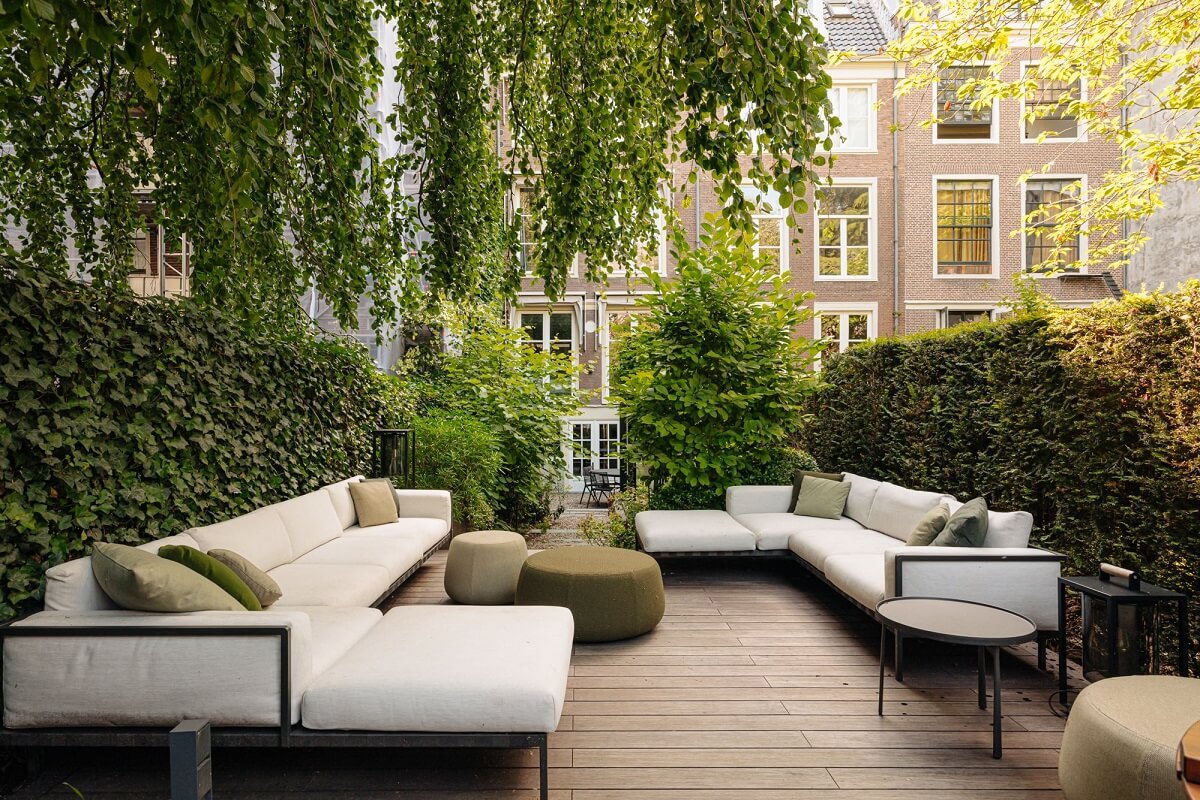 A Luxurious Amsterdam Canal House with High Ceilings 24 luxe city garden seaitng area amsterdam canal house