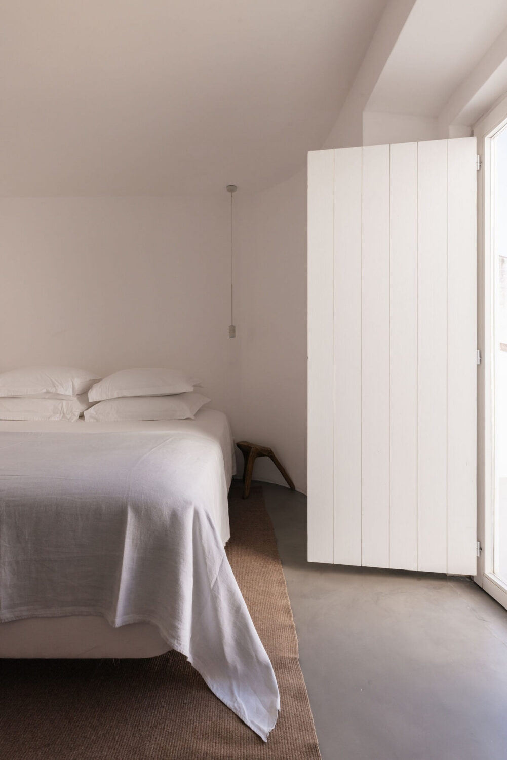 A Renovated 19th Century House with a Minimalistic Decor 7 minalistic-bedroom-window-shutter-nordroom