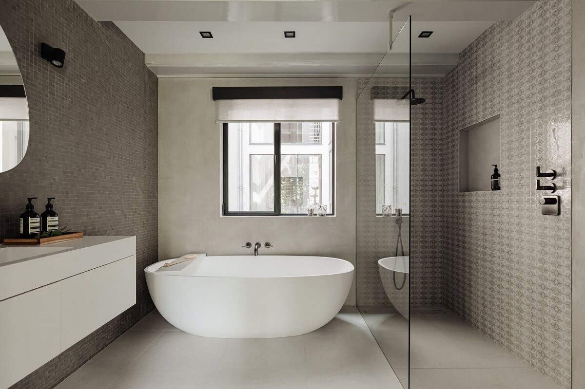 A Luxurious Amsterdam Canal House with High Ceilings 19 modern bathroom gray tiles freestanding bath walk in shower