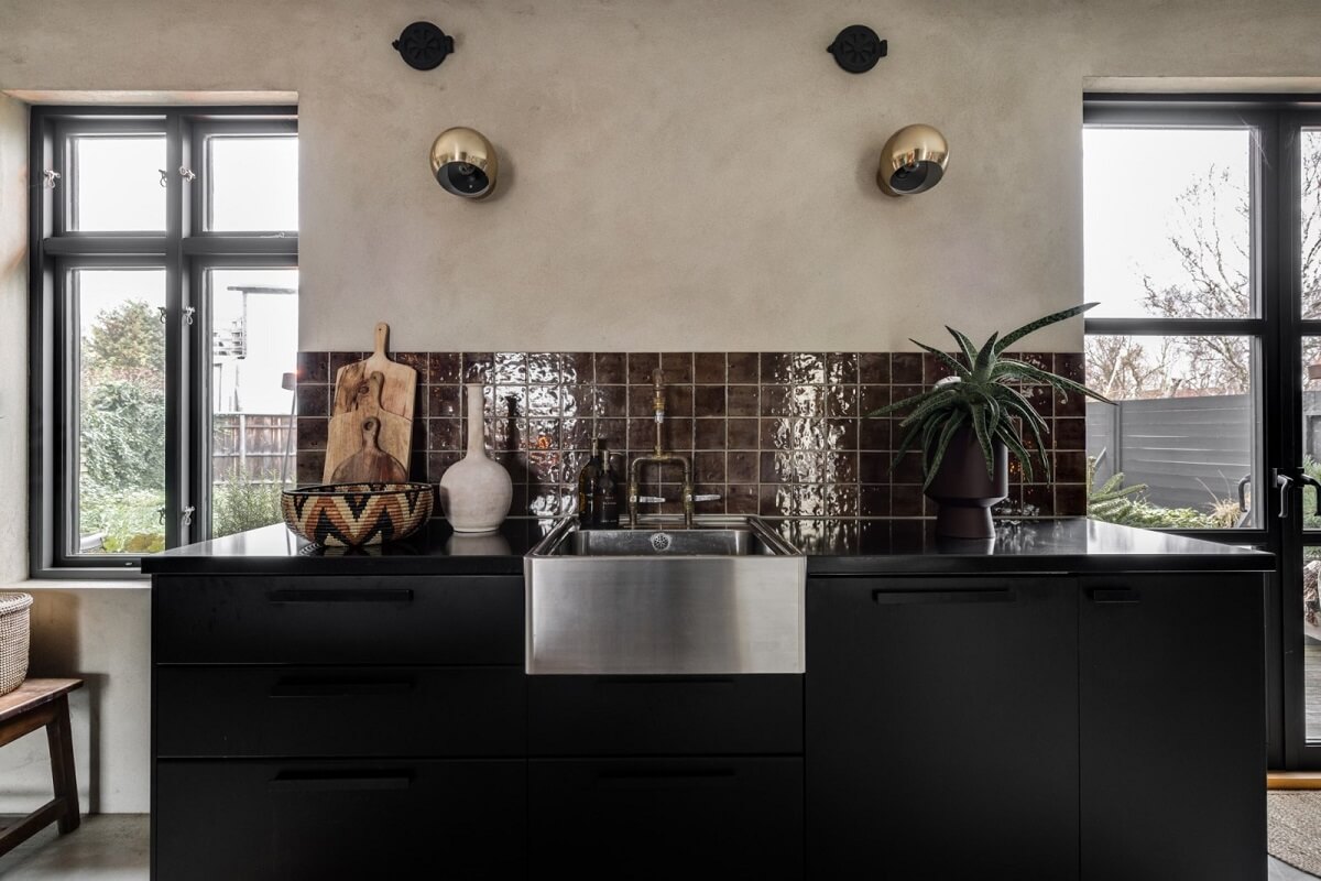 A Unique Bohemian Family Home in a Former Swedish Bakery 15 modern-black-kitchen-cabinets-burgundy-tiles-nordroom