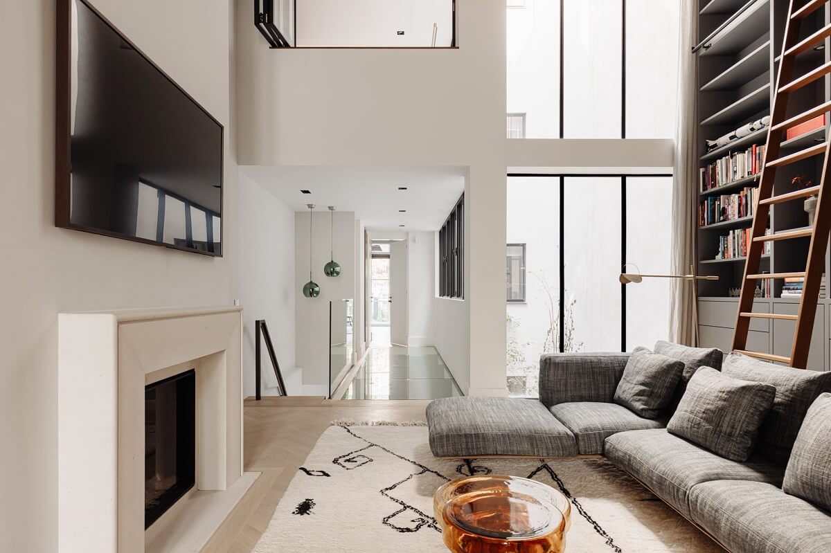 A Luxurious Amsterdam Canal House with High Ceilings 9 modern living room double height ceiling bookcases