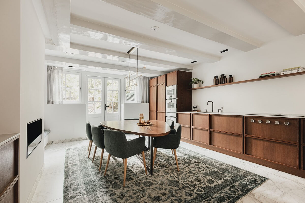 A Luxurious Amsterdam Canal House with High Ceilings 11 oak kitchen dining table large rug
