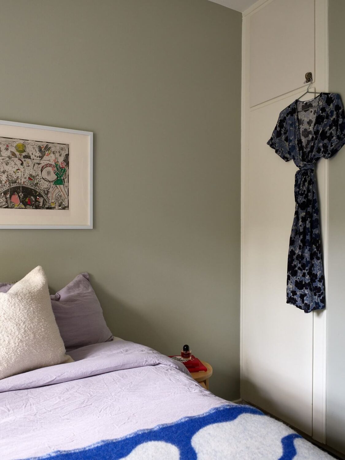 Soft Yellow Walls in a Swedish Apartment 15 olive-green-wall-bedroom