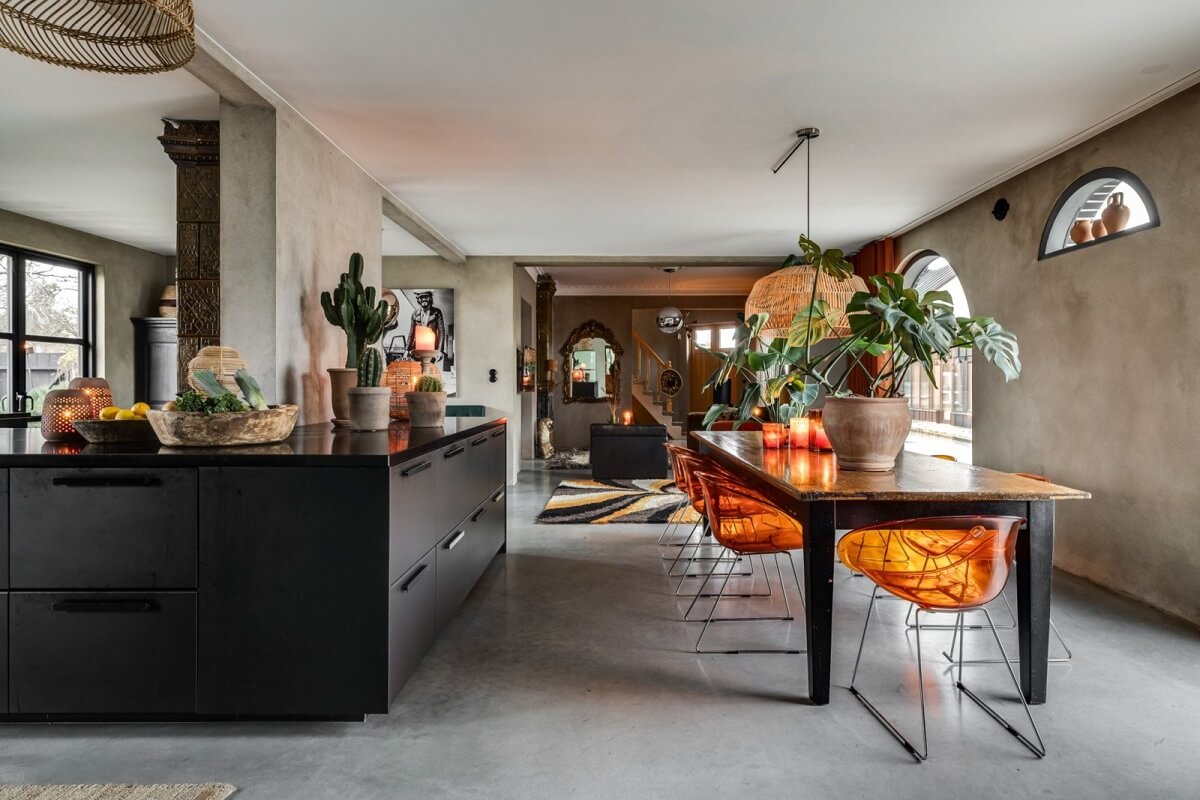 A Unique Bohemian Family Home in a Former Swedish Bakery 8 open-plan-kitchen-dining-room-orange-chairs-nordroom