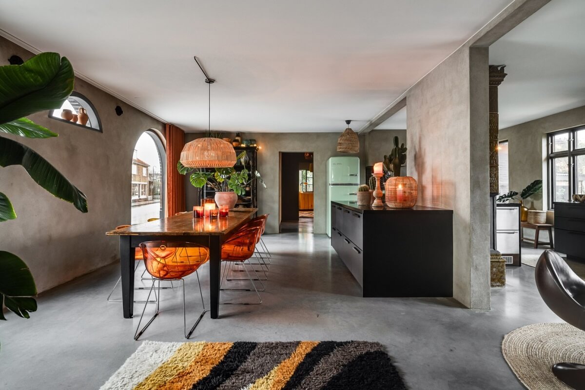A Unique Bohemian Family Home in a Former Swedish Bakery 9 open-plan-kitchen-dining-room-orange-color-accents-nordroom