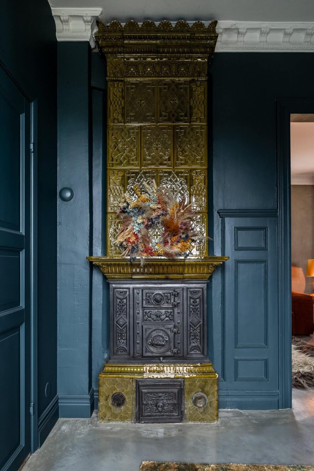 A Unique Bohemian Family Home in a Former Swedish Bakery 7 original-green-fireplace-dark-blue-room-nordroom