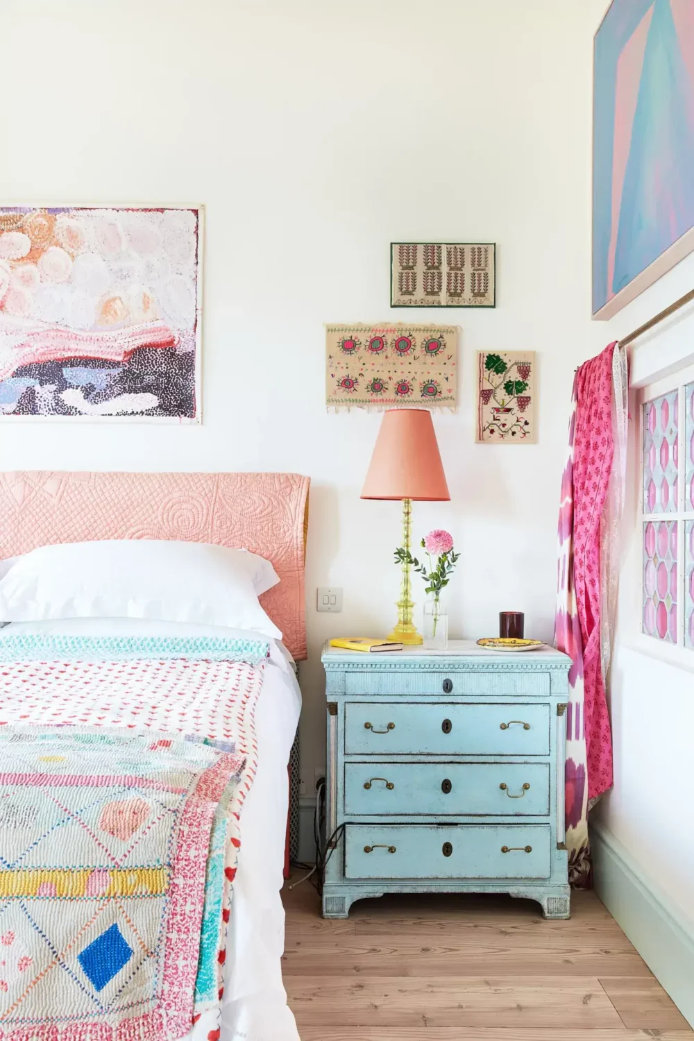 A Playful Colorful Eclectic Artist Home in London 23 pastel colors bedroom antique bedside dresser