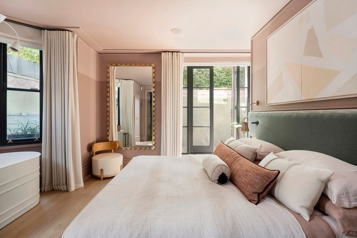 An Award-Winning Apartment with Color Accents in Notting Hill 11 pink-master-bedroom-green-headboard-bath-tub-nordroom