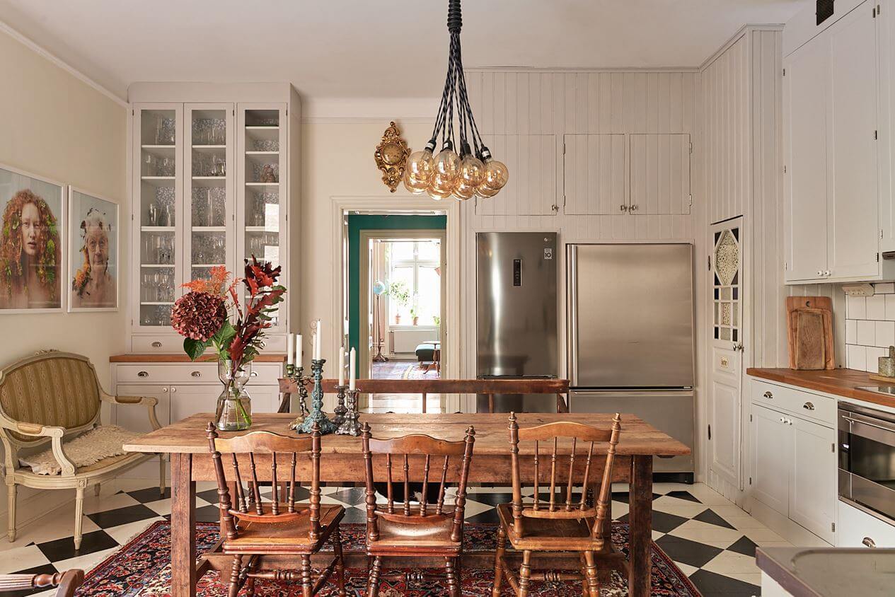 A Romantic Apartment with Original Details 16 rustic-wooden-table-kitchen-checkerboard-floor