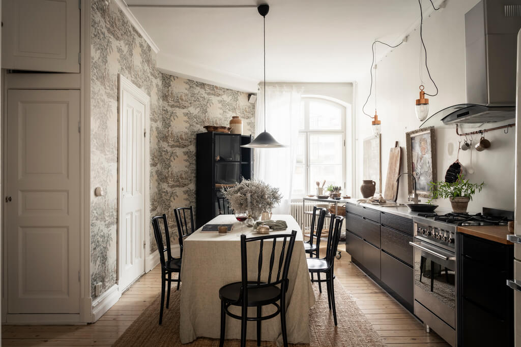 A Scandinavian Studio Apartment with Black Walls 14 scandinavian kitchen black cabinets wallpaper
