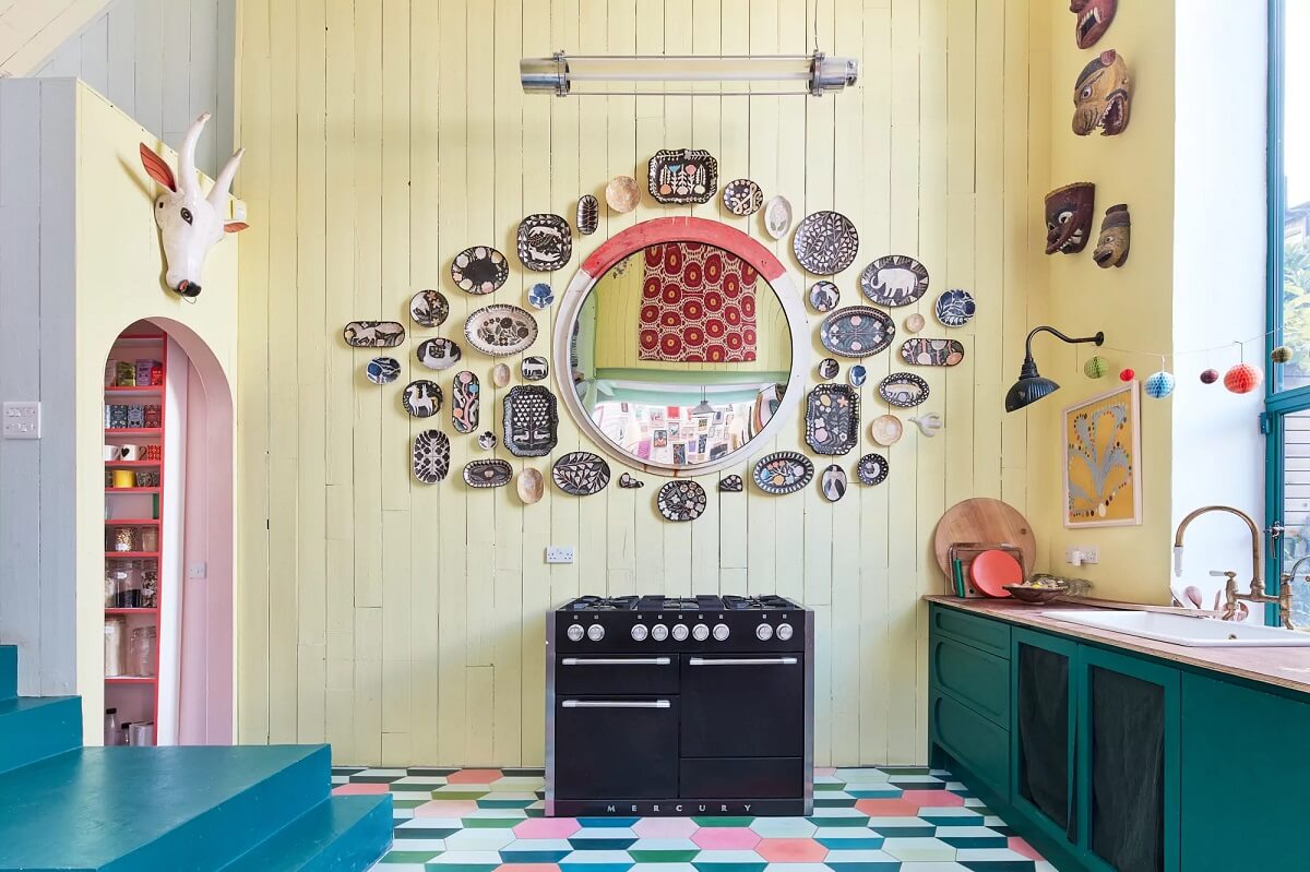 A Playful Colorful Eclectic Artist Home in London 3 teal green kitchen yellow walls