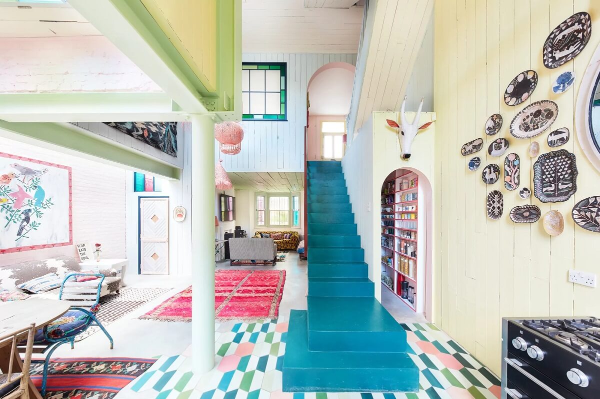 A Playful Colorful Eclectic Artist Home in London 10 teal green staircase