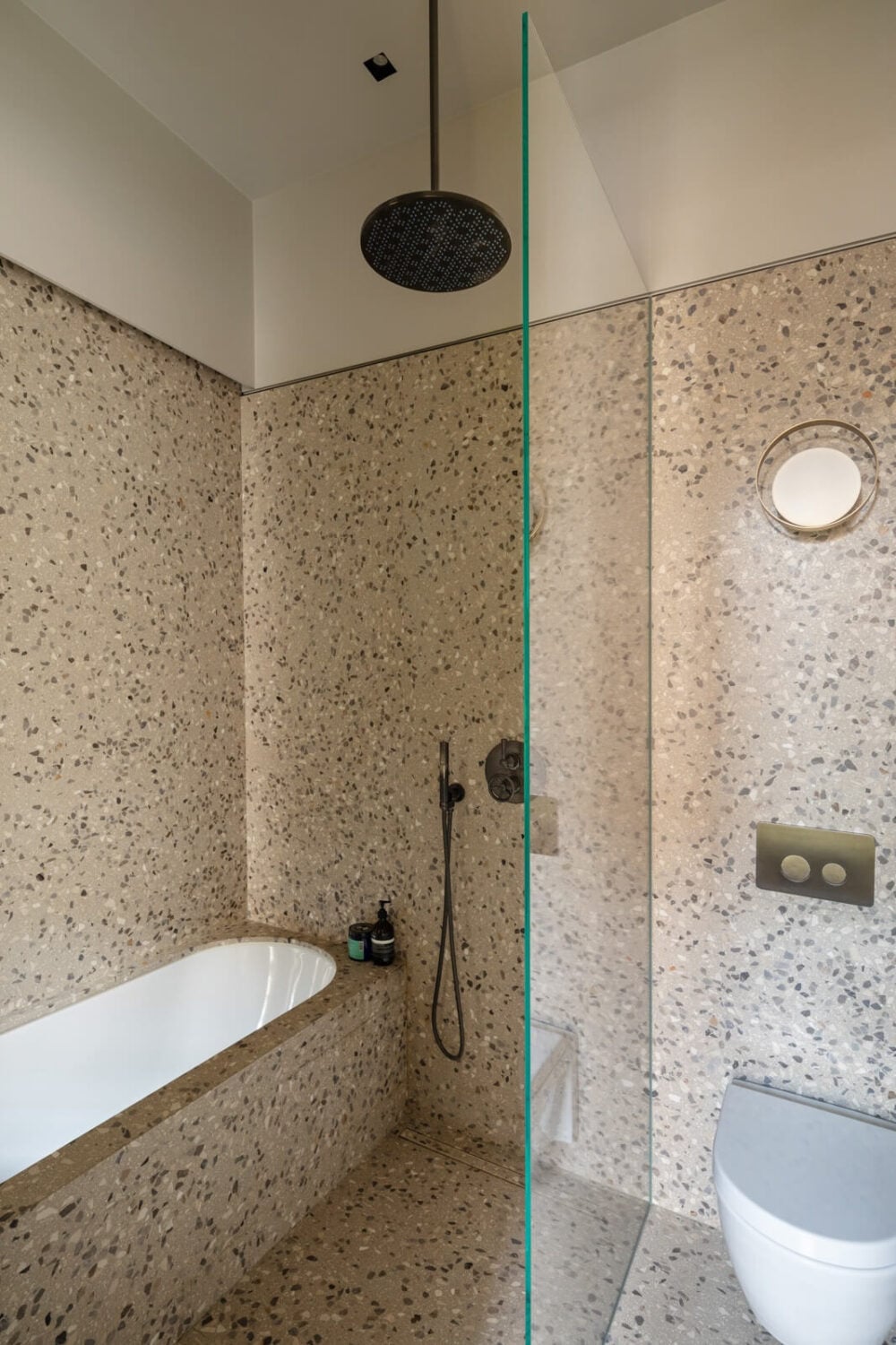 A Unique London Home with Terrazzo Tiles and a Roof Terrace 19 terrazzo bathroom with shower and bath nordroom