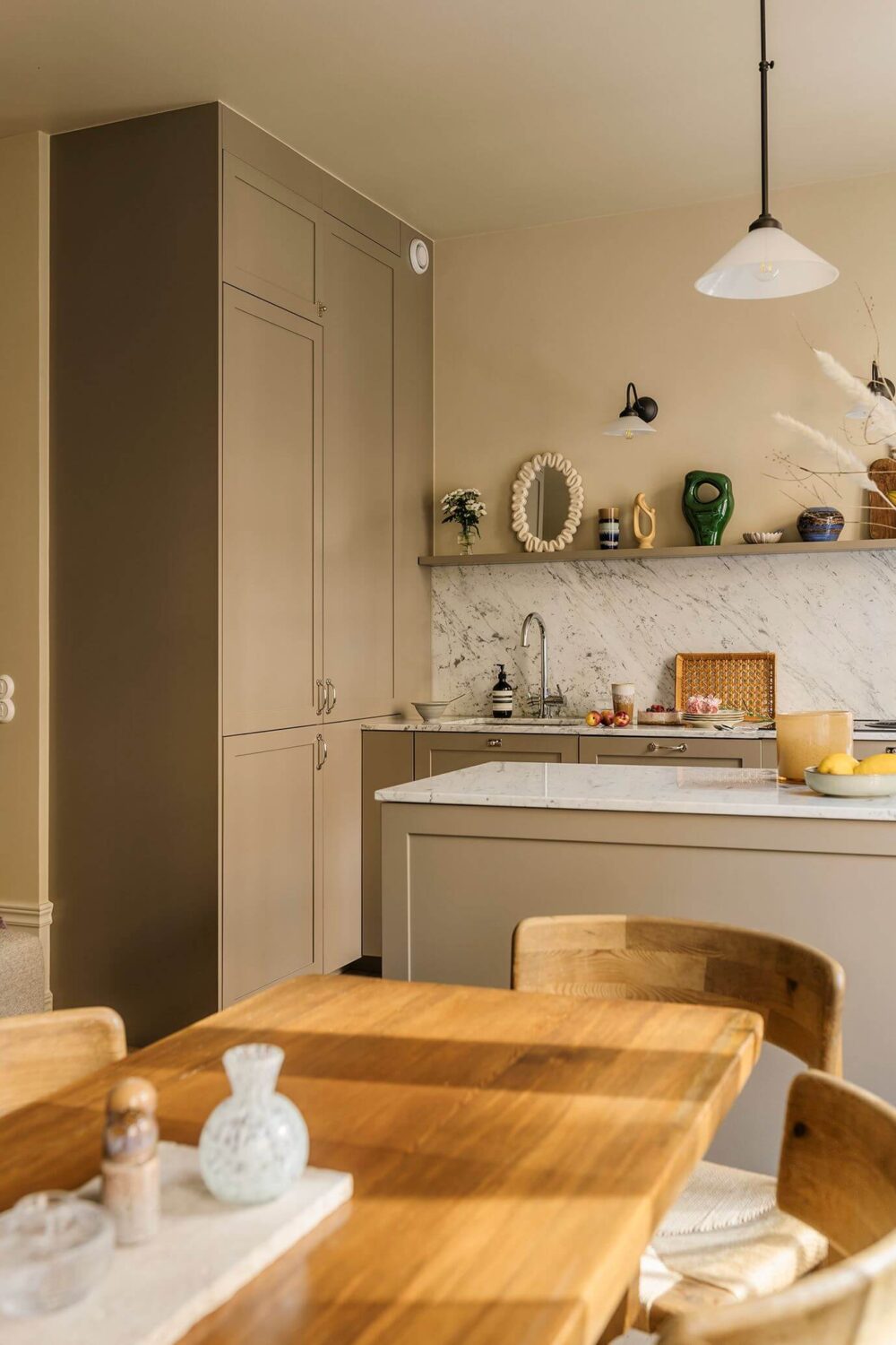 A Cozy Scandinavian Apartment with a Cobalt Color Accent 8 view into kitchen from dining table