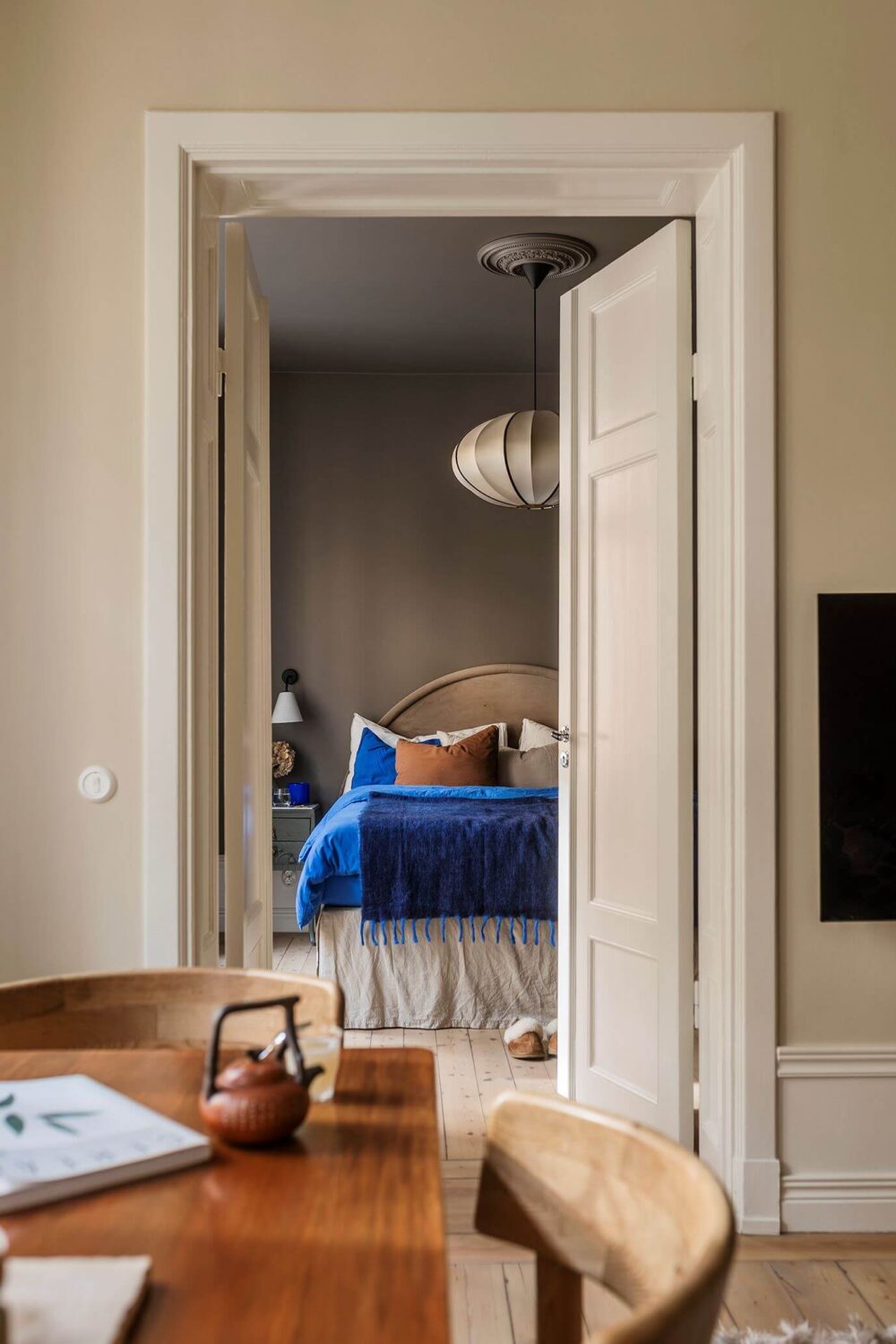 A Cozy Scandinavian Apartment with a Cobalt Color Accent 13 view to bedroom from living room