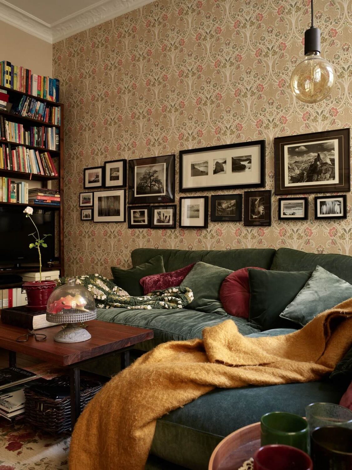 A Warm Vintage Apartment in Stockholm 3 vintage-living-room-green-sofa-wallpaper-nordroom