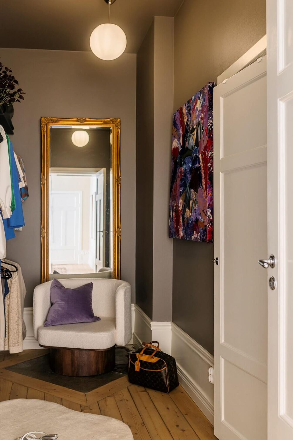 A Cozy Scandinavian Apartment with a Cobalt Color Accent 18 walk in closet A Cozy Scandinavian Apartment with a Cobalt Color Accent