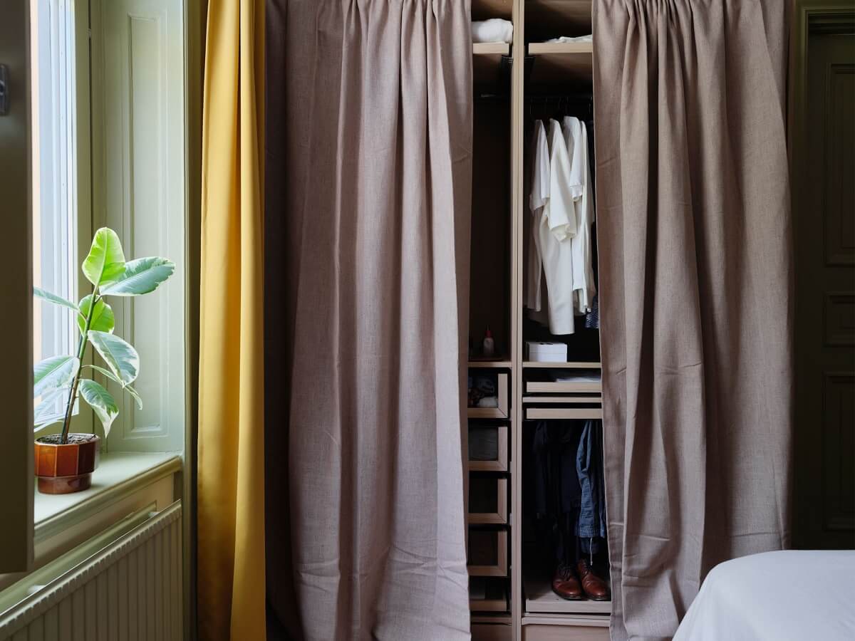 A Scandi Apartment Mixes Vintage with Contemporary Design 15 wardrobes-with-curtains-nordroom