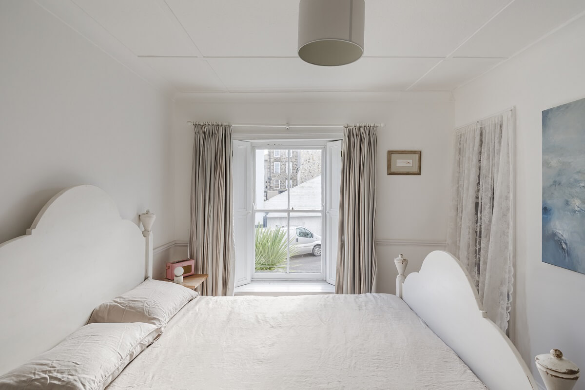 A Light Coastal Home in England 16 white coastal bedroom