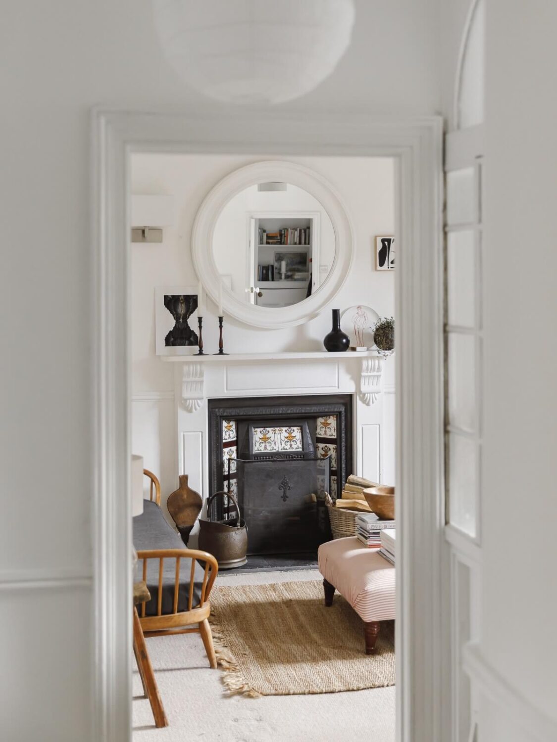 A Light Coastal Home in England 6 white coastal living room black fireplace
