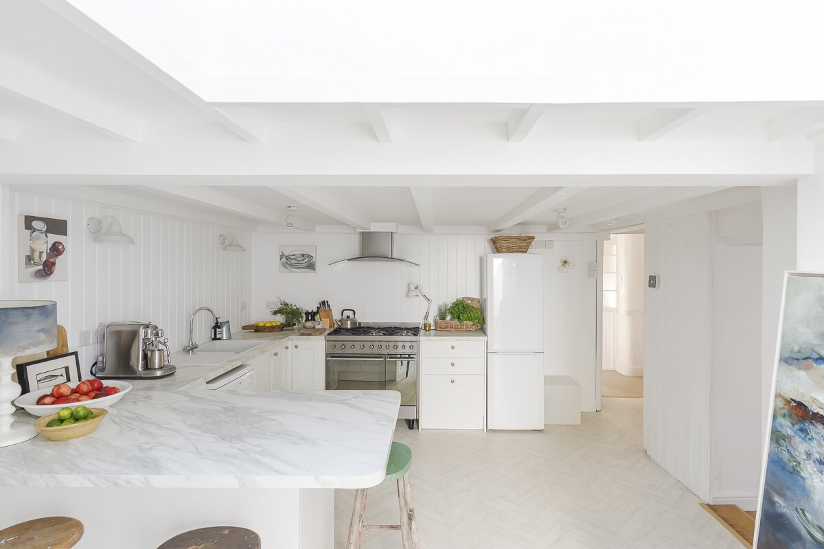 A Light Coastal Home in England 7 white kitchen skylight
