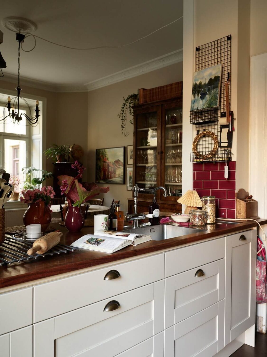 The Pros and Cons of a Wooden Kitchen Countertop 21 white-kitchen-table-red-tiles-nordroom