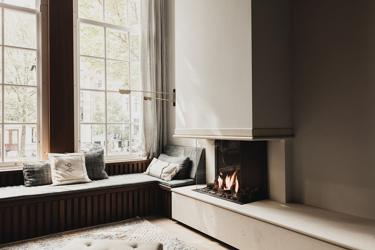 A Luxurious Amsterdam Canal House with High Ceilings 5 window seat fireplace canal home