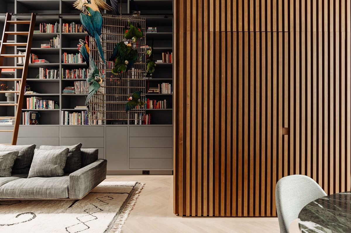 A Luxurious Amsterdam Canal House with High Ceilings 3 wooden accent wall bookcases living room