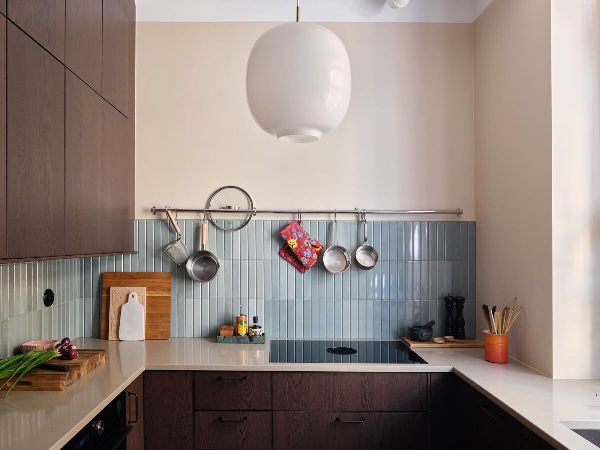 A Scandi Apartment Mixes Vintage with Contemporary Design 18 wooden-kitchen-blue-backsplash-tiles-nordroom
