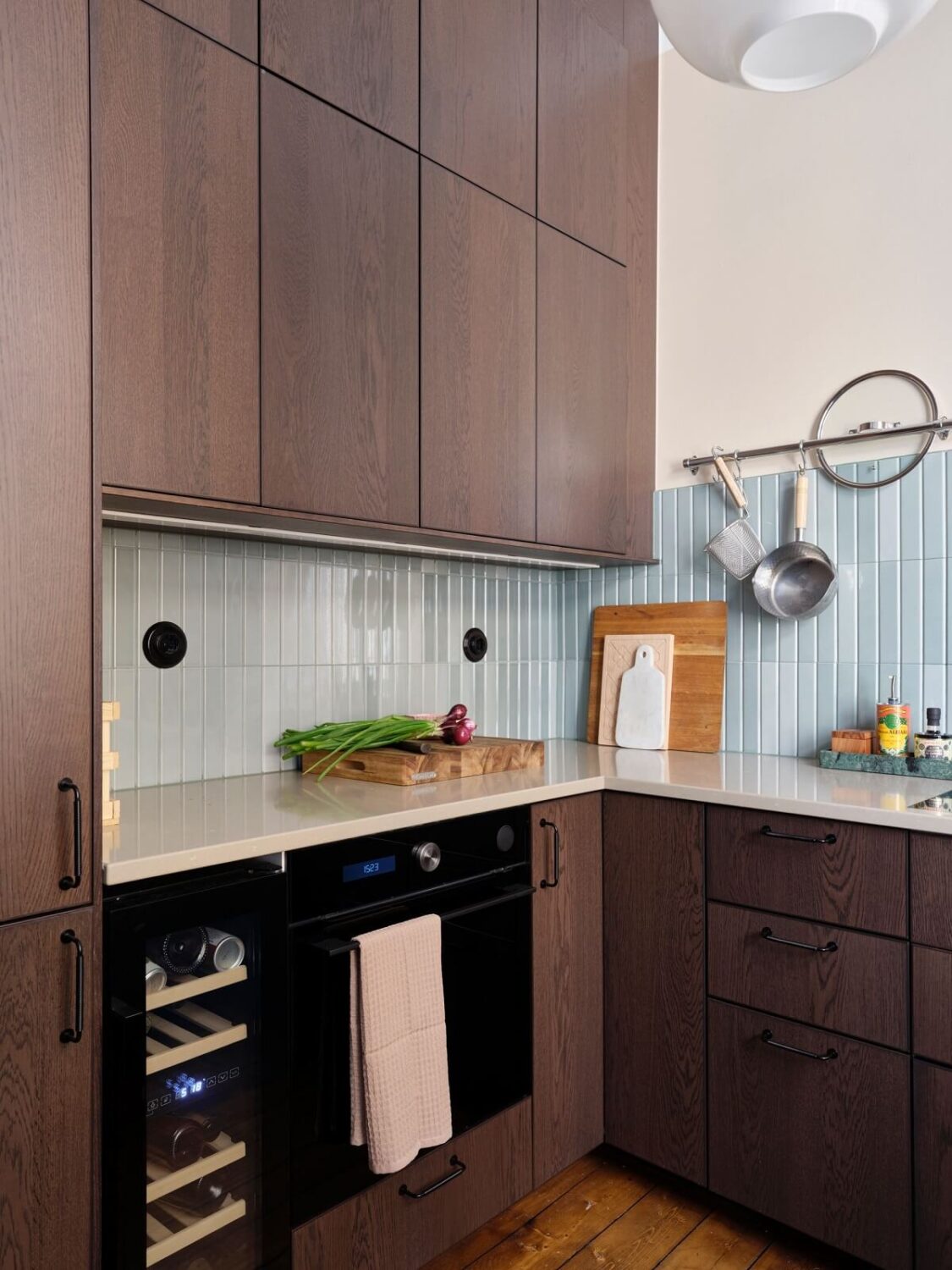 A Scandi Apartment Mixes Vintage with Contemporary Design 20 wooden-kitchen-cabnets-blue-tiles-nordroom