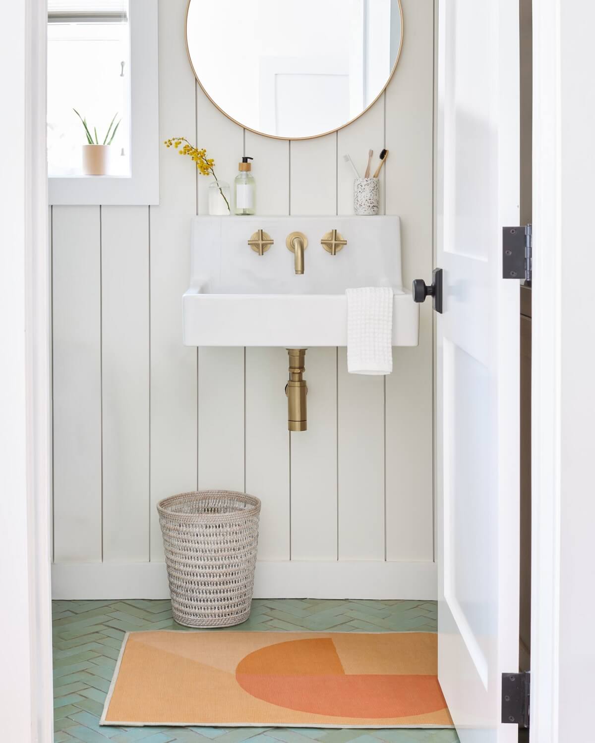 Pantone Color of the Year 2024 Home Decor Inspiration 13 bathroom Pantone_Peach_Fuzz_Pop_Divide_Rug_Ruggable