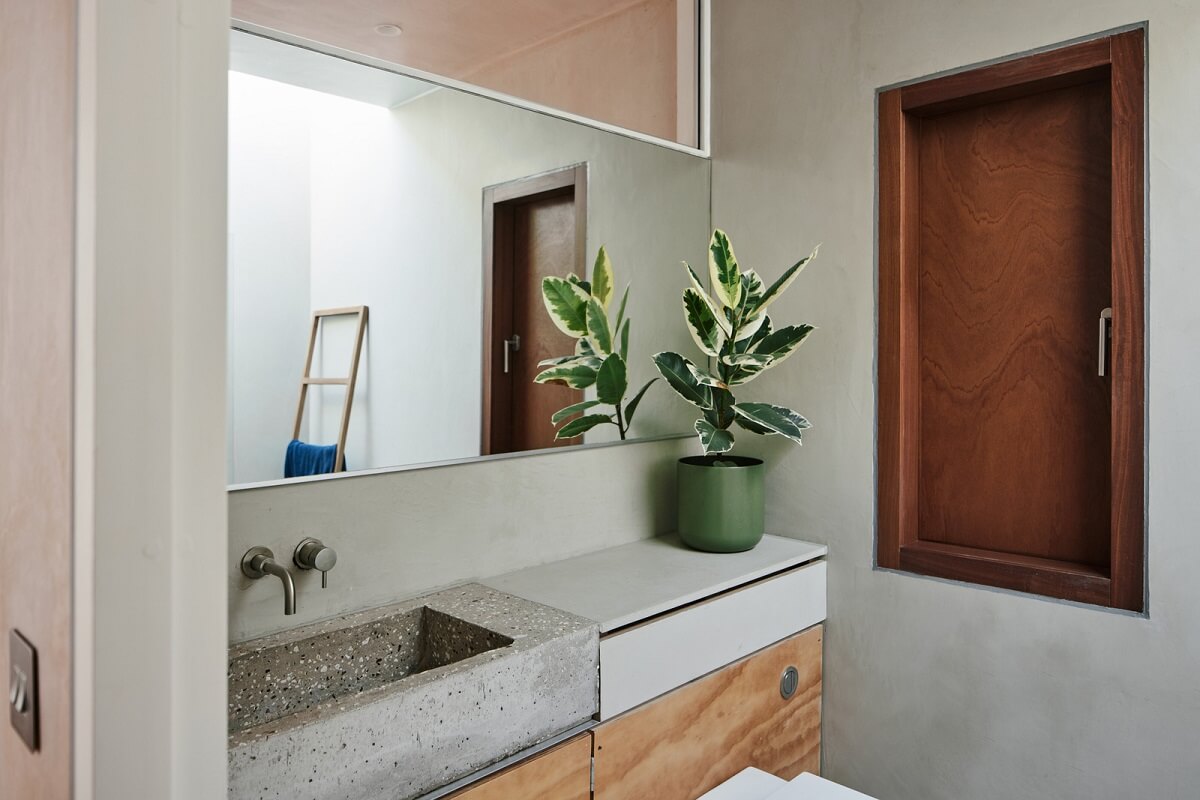 A Modern House Centered Around a Courtyard 22 bathroom-concrete-sink