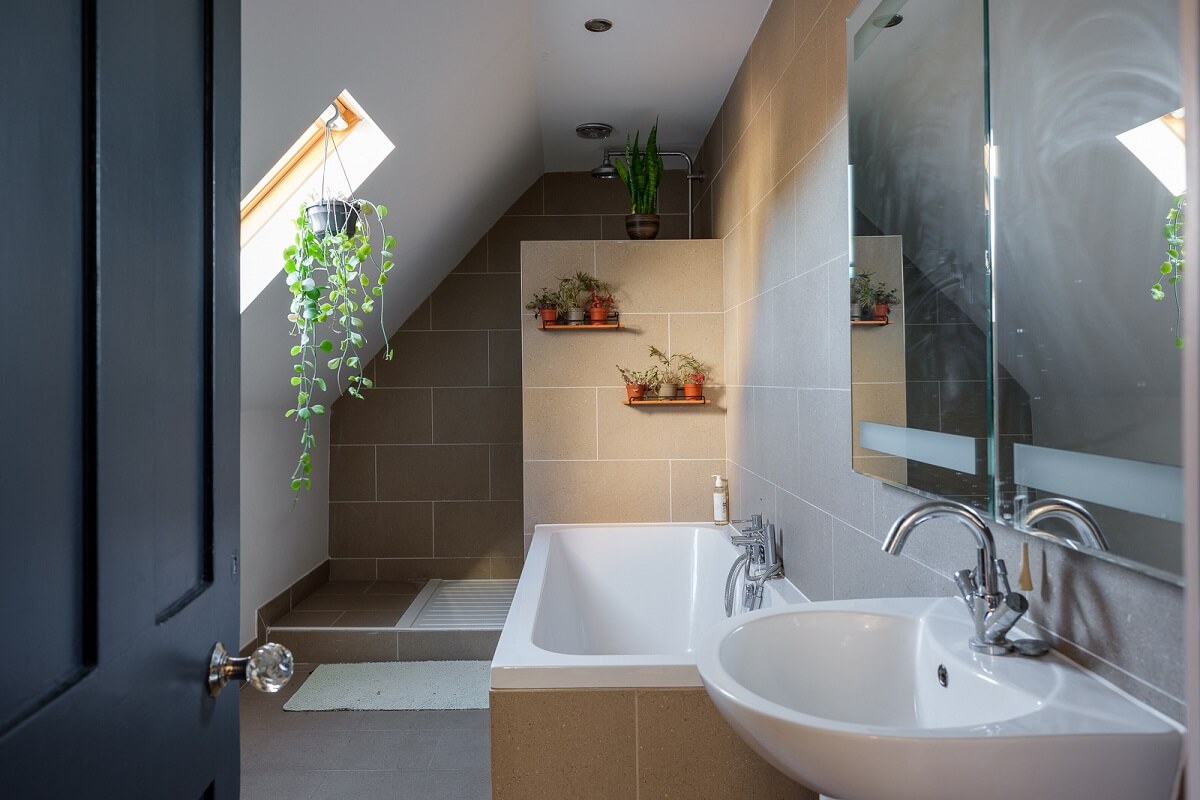 Playful Colors in a Historic Home in Kent 24 bathroom-with-slanted-ceiling-and-bath-nordroom