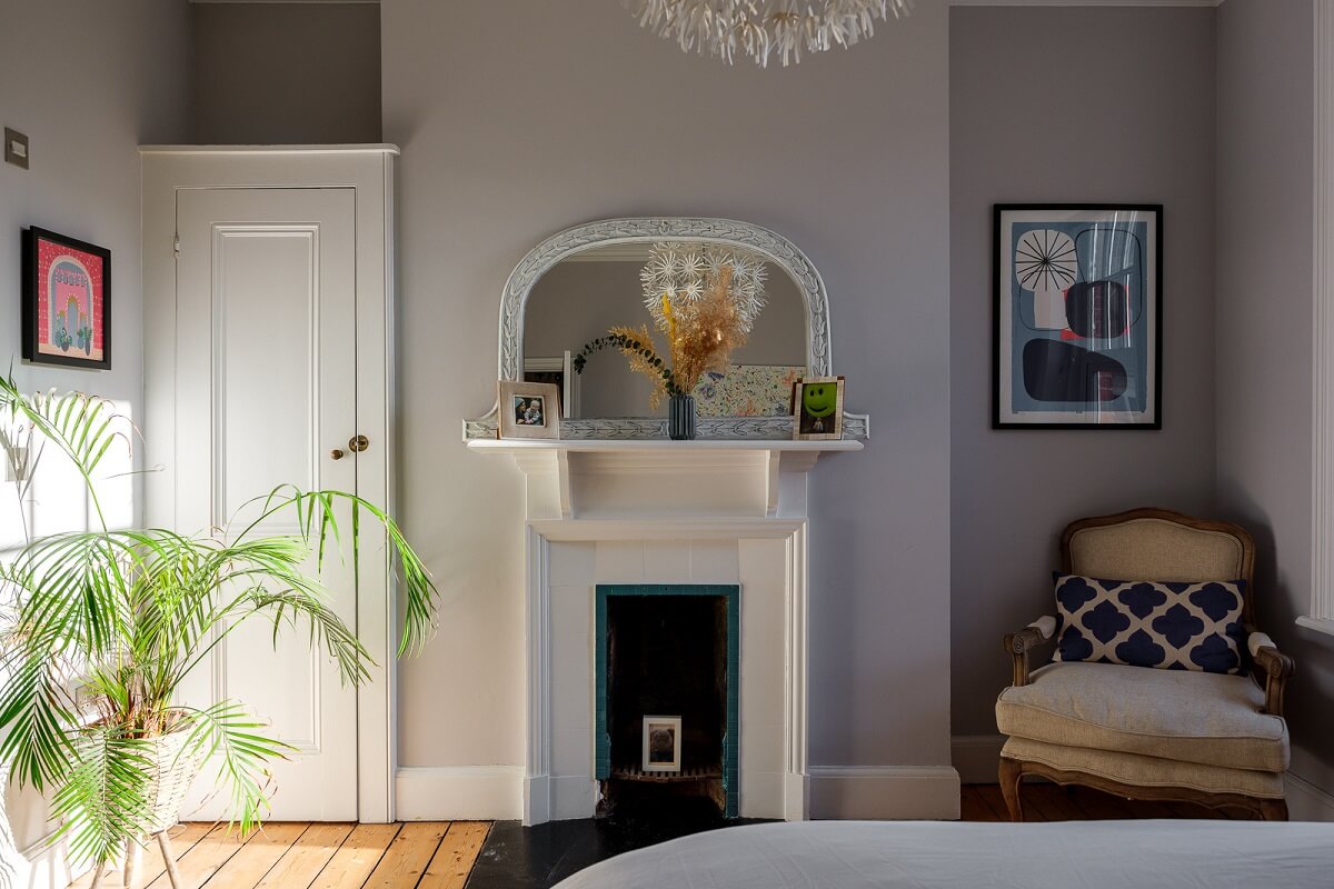 Playful Colors in a Historic Home in Kent 13 bedroom-light-gray-walls-white-fireplace-nordroom