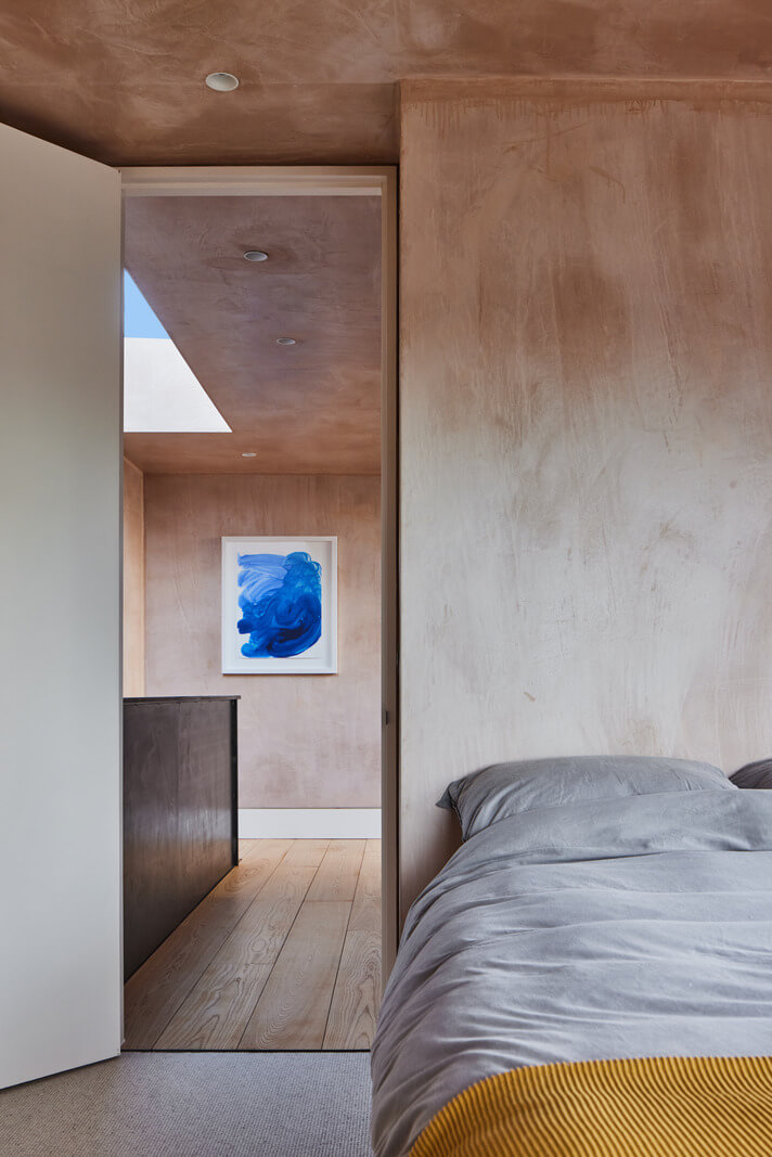 A Modern House Centered Around a Courtyard 24 bedroom-ochre-yellow-throw