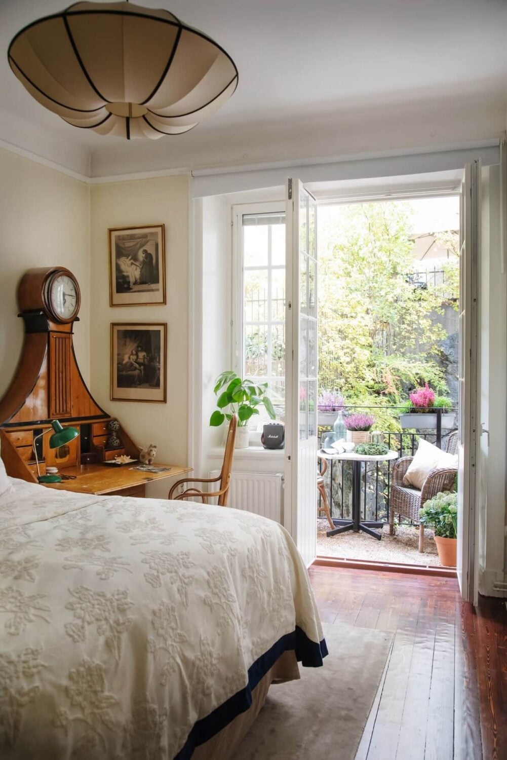 A Cozy Swedish Apartment with a Green Kitchen 22 bedroom with antique desk and balcony