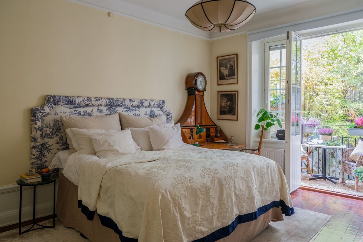 A Cozy Swedish Apartment with a Green Kitchen 23 bedroom with patterned headboard