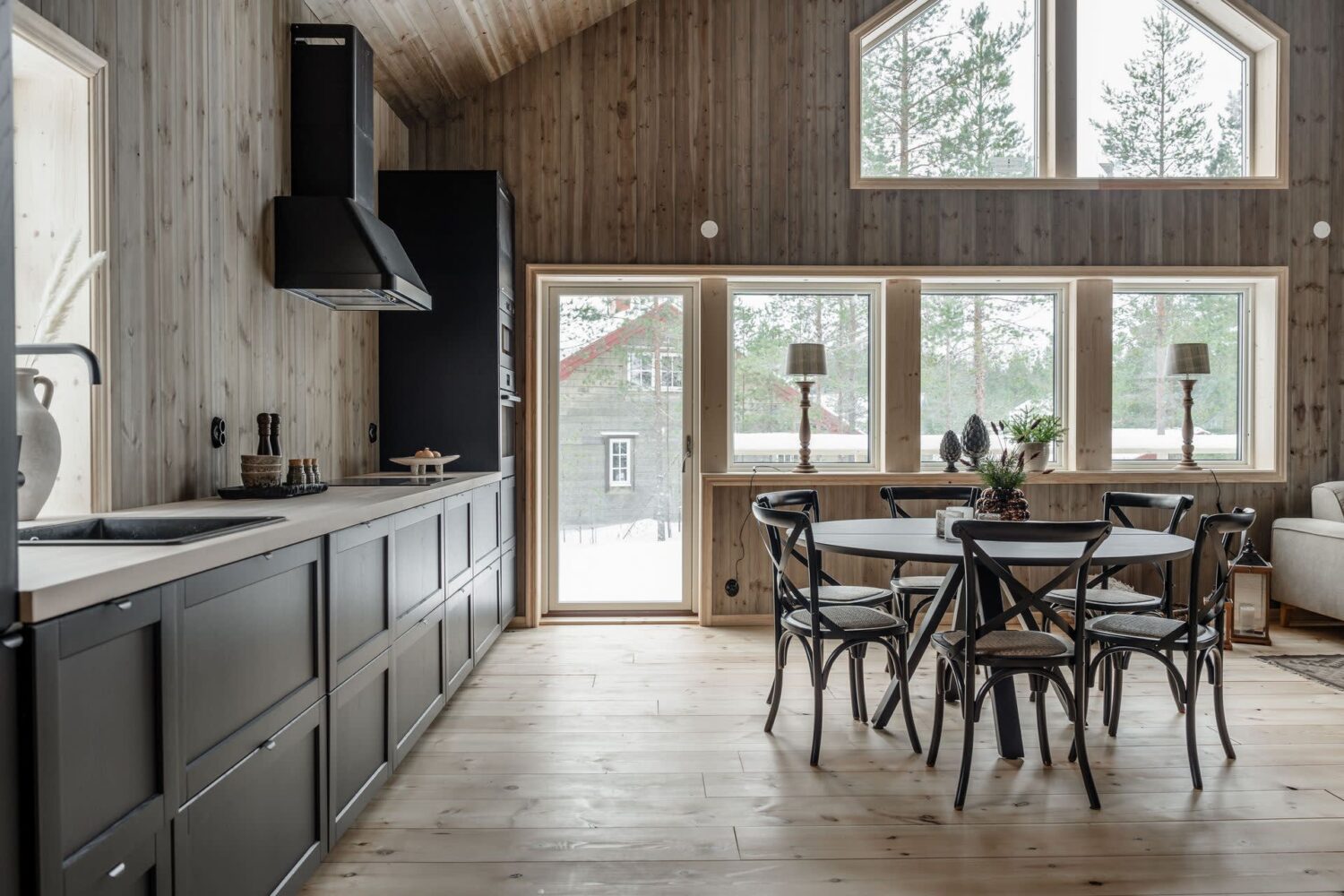 A Cozy Log House in Sweden 11 black-kitchen-round-dining-table-log-house