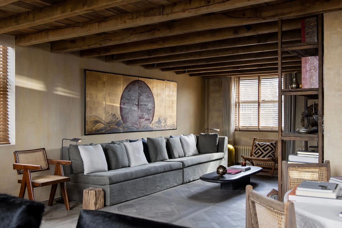 Modern Rustic Interiors in a Notting Hill Penthouse 5 cozy-seating-area-gray-sofa-wooden-ceiling