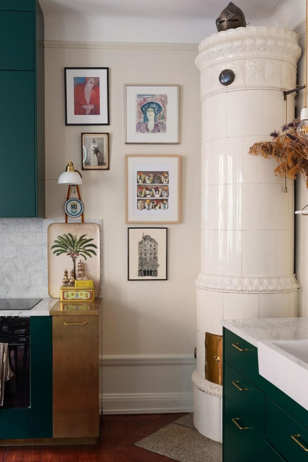 A Cozy Swedish Apartment with a Green Kitchen 10 fireplace in kitchen green cabinets nordroom