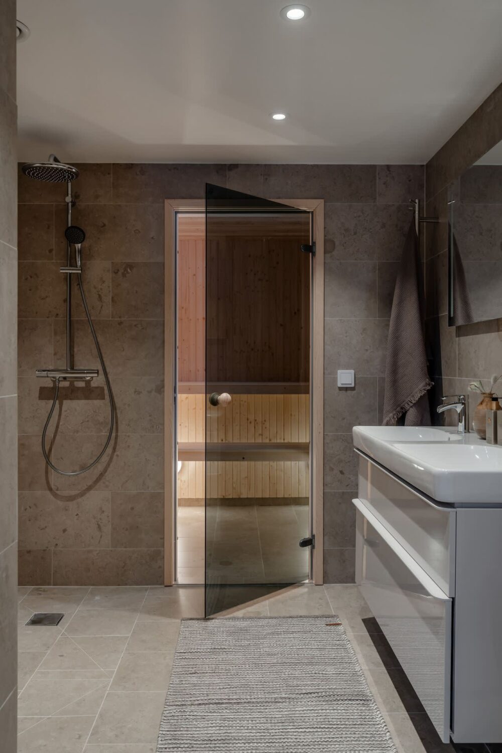 A Cozy Log House in Sweden 21 gray-bathroom-sauna-log-house