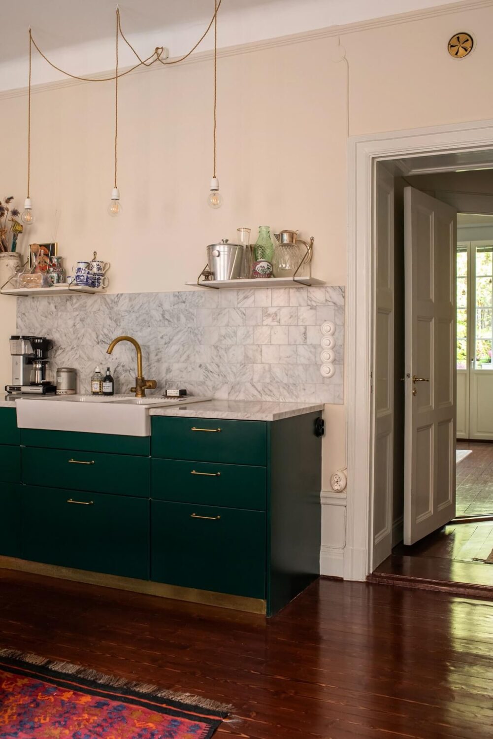 A Cozy Swedish Apartment with a Green Kitchen 12 green kitchen carrera marble worktop beige walls